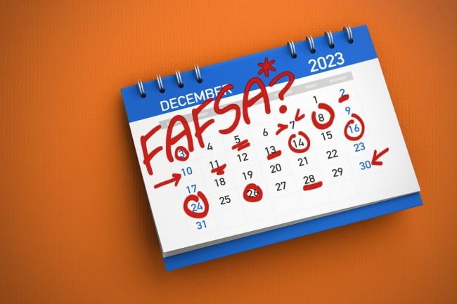 A calendar with the word FAFSA? written on it, covered in red markings