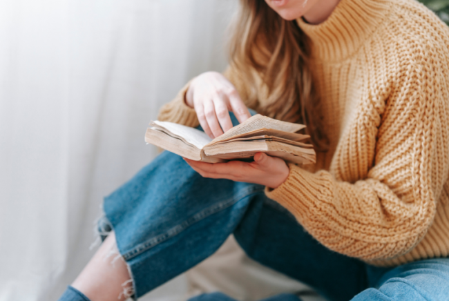 A young woman reading a book.