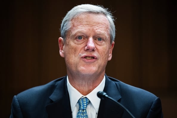 Charlie Baker, a light-skinned man with gray hair wearing a business suit, testifies before Congress