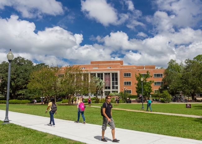 Students walk around Robert Manning Strozier Library at Florida State University