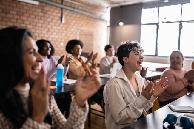 Students clapping in the classroom