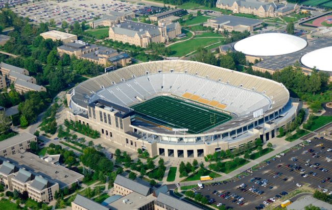 An aerial view of an empty American college football stadium.