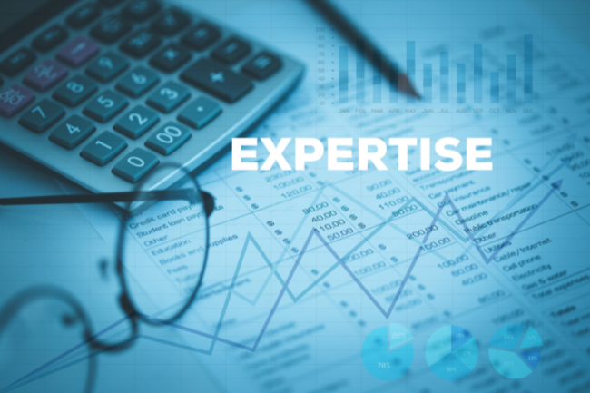 The word "expertise" in white against a blue background. Visible items in the background include a pair of glasses, a calculator, a pen and charts/graphs.