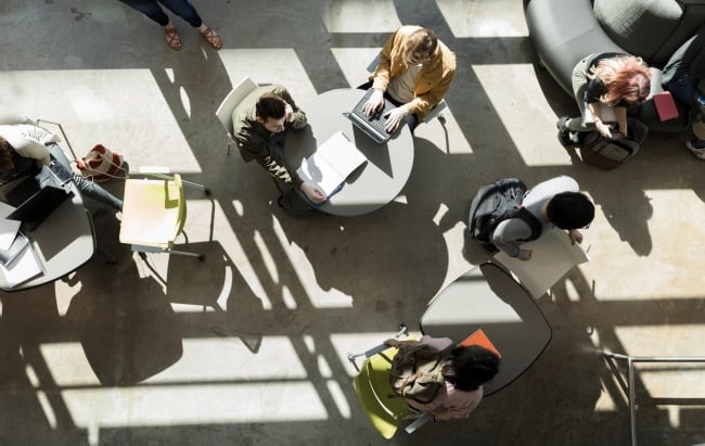 An aerial shot of students working in a common space