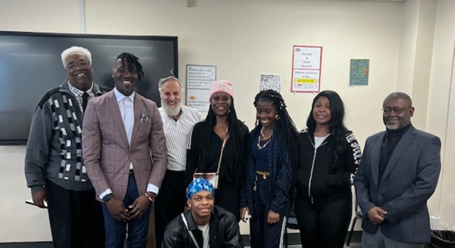 Students at South Carolina State University stand smiling with Meir Muller and Devin Randolph.