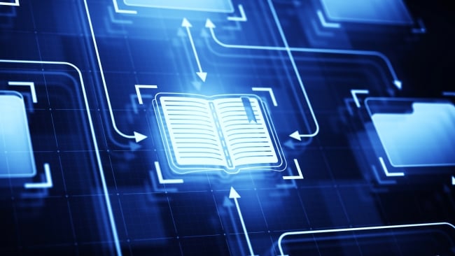 A digitized book is in the middle of the photo, surrounded by a blue background and several arrows pointing toward computer folders