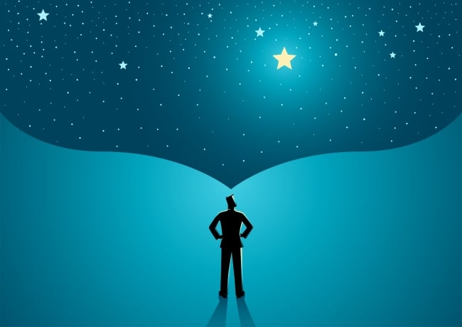 Man looks up at what appears to be a big dream scene with a shining bright star