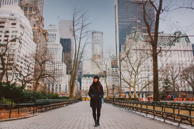 Young woman walks through Central Park in New York