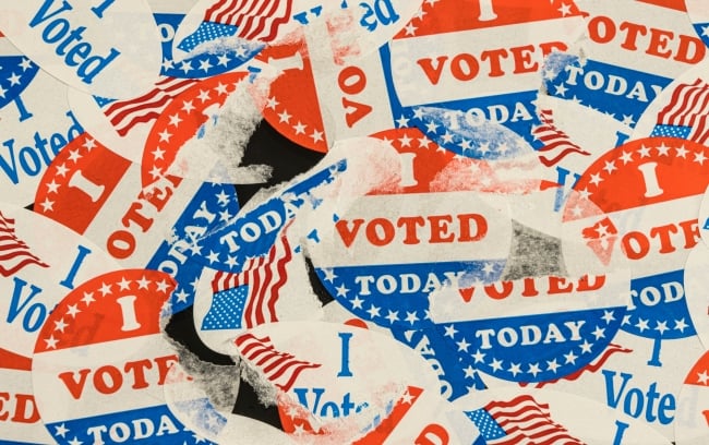 Photo of many ripped and tattered "I voted today" stickers.