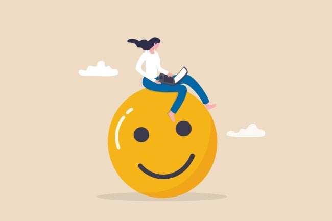 An illustration of a woman with an open laptop sitting atop a large yellow smiley face.