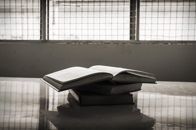 Books in a prison cell