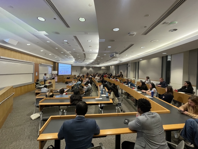 Students sit in lecture hall for constructive dialogue event