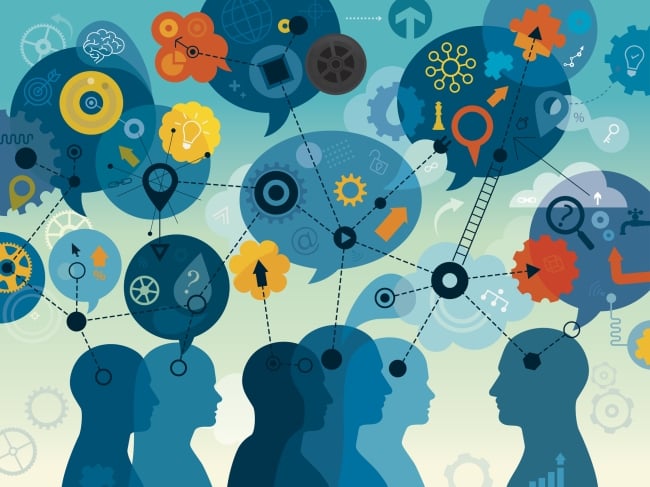 An abstract image of a group of five students and an instructor, in silhouette; speech bubbles above their head feature icons associated with education, such as a lightbulb to signify ideas, gears and wheels to signify thinking and a magnifying glass to signify investigation.