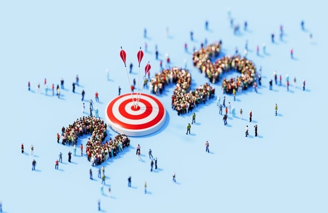 Human crowd surrounding 2025 and red bull's-eye target object on blue background. 