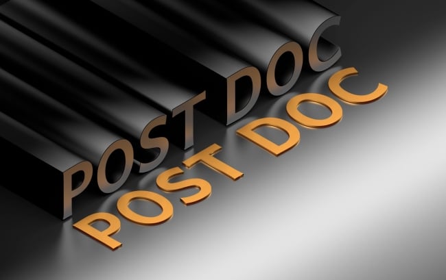 An illustration featuring the word "Post Doc," variously written in orange and charcoal grey shadow-like font, against a black/gray background.