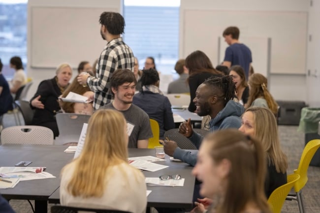 College students mingle with professionals at a Worcester Polytechnic Institute sustainability career fair