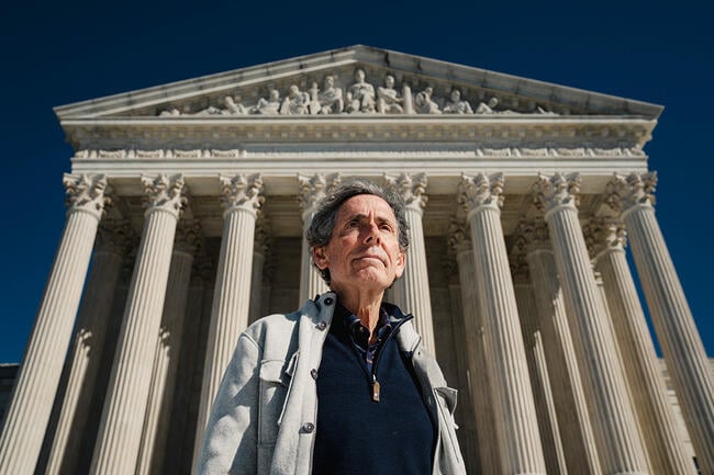 Man in front of Supreme Court building