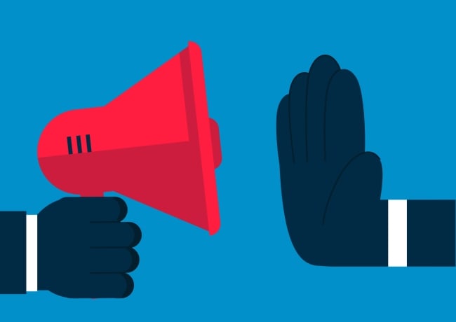 An illustration of a large hand being held up in front of a loudspeaker, seemingly as if to stop the person using the loudspeaker from speaking.