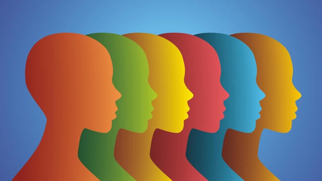 A series of six human heads, in different colors--orange, green, yellow, red, blue and gold--in profile.