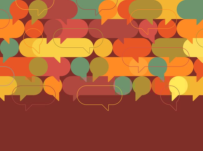 A collection of speech bubbles of many different colors against a brown background.