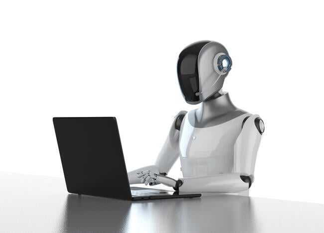 An illustration of a robot working at a computer.