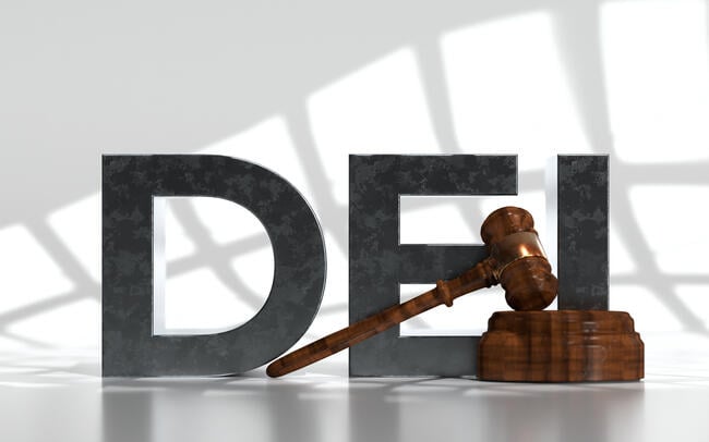 The acronym "DEI" in large black 3-D letters next to a judge's gavel.