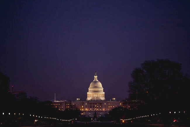 An image of the U.S. Capitol building at night.