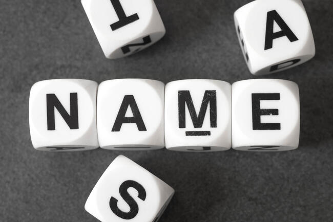 The word "name" is spelled out on cubes.