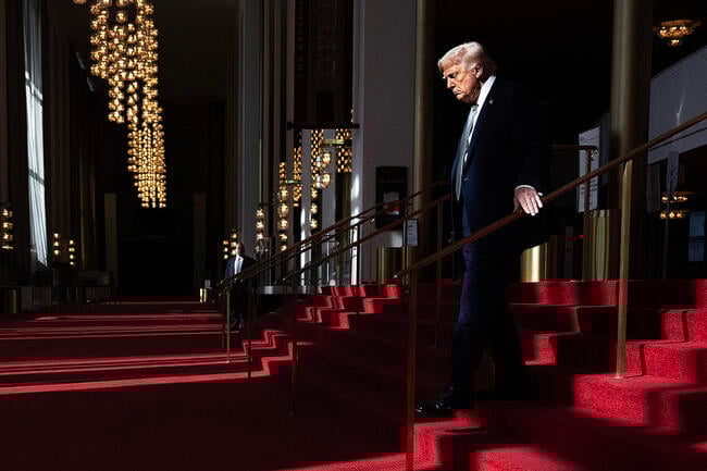 President Donald Trump walks down the stairs of the John F. Kennedy Center for the Performing Arts.