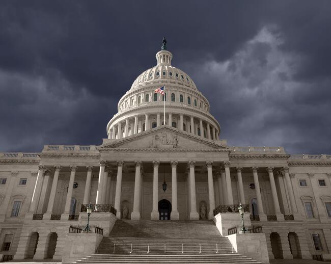 A photo of the U.S. Capitol building against a dark sky.
