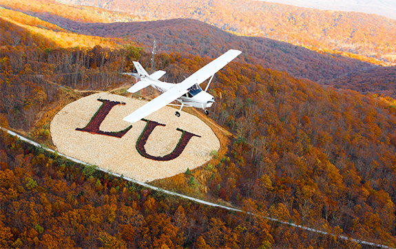 Liberty University's operations in Lynchburg stretch from airports to branded mountainsides.