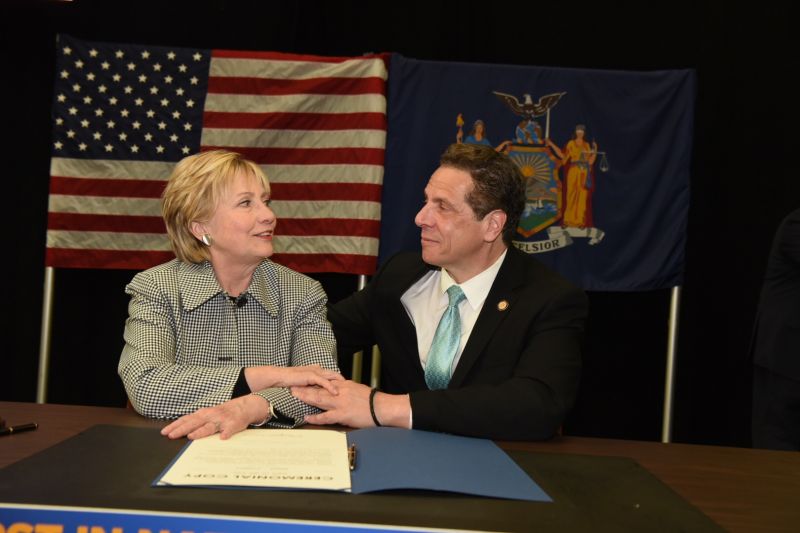 Hillary Clinton and New York Governor Andrew Cuomo at the signing of the bill creating New York's Excelsior Scholarship.