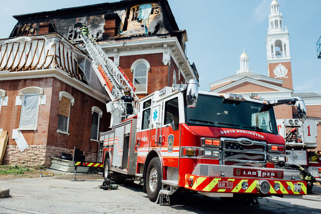 Fire engine with ladder in front of the Pringle Herbarium in Vermont.