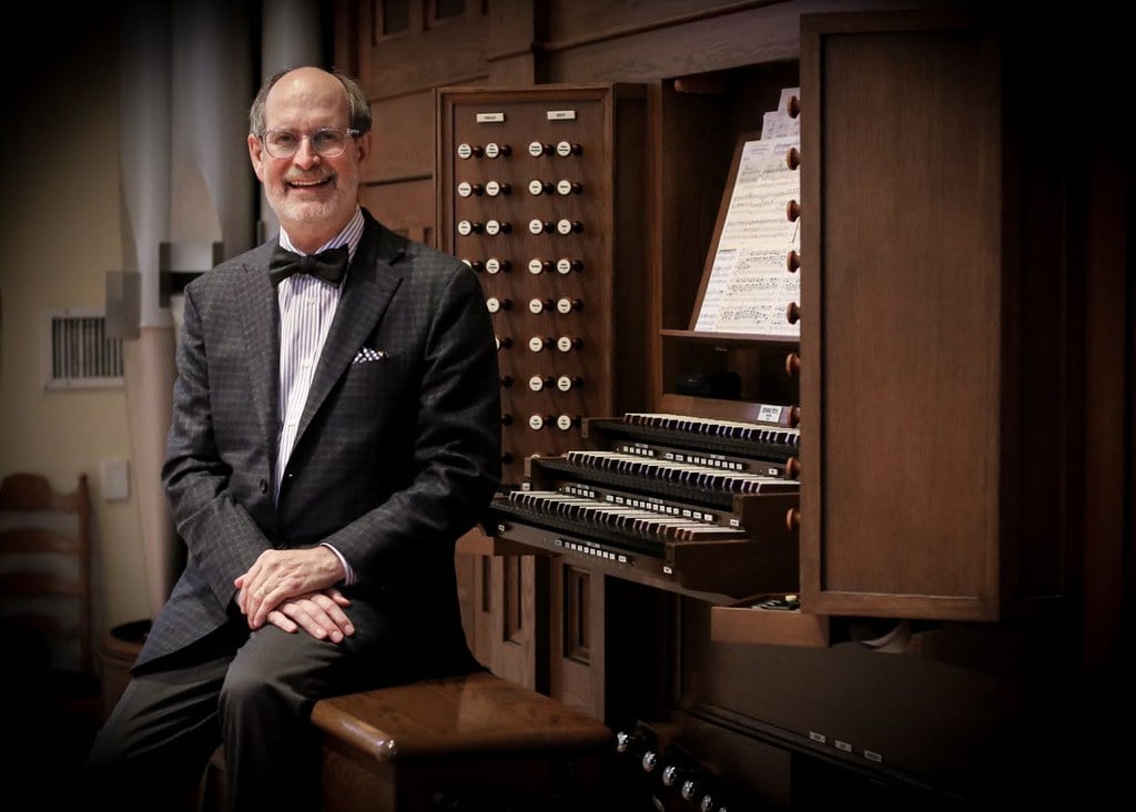 James Mellichamp, a middle-aged white man with a receding hairline, glasses, and wearing a bow tie.