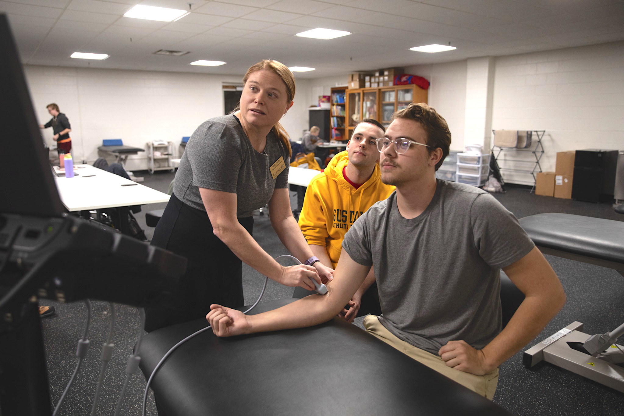 Mary Westby, director of the athletic training program at Gustavus Adolphus College, works with students.