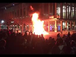 Photo of protestors around a fire