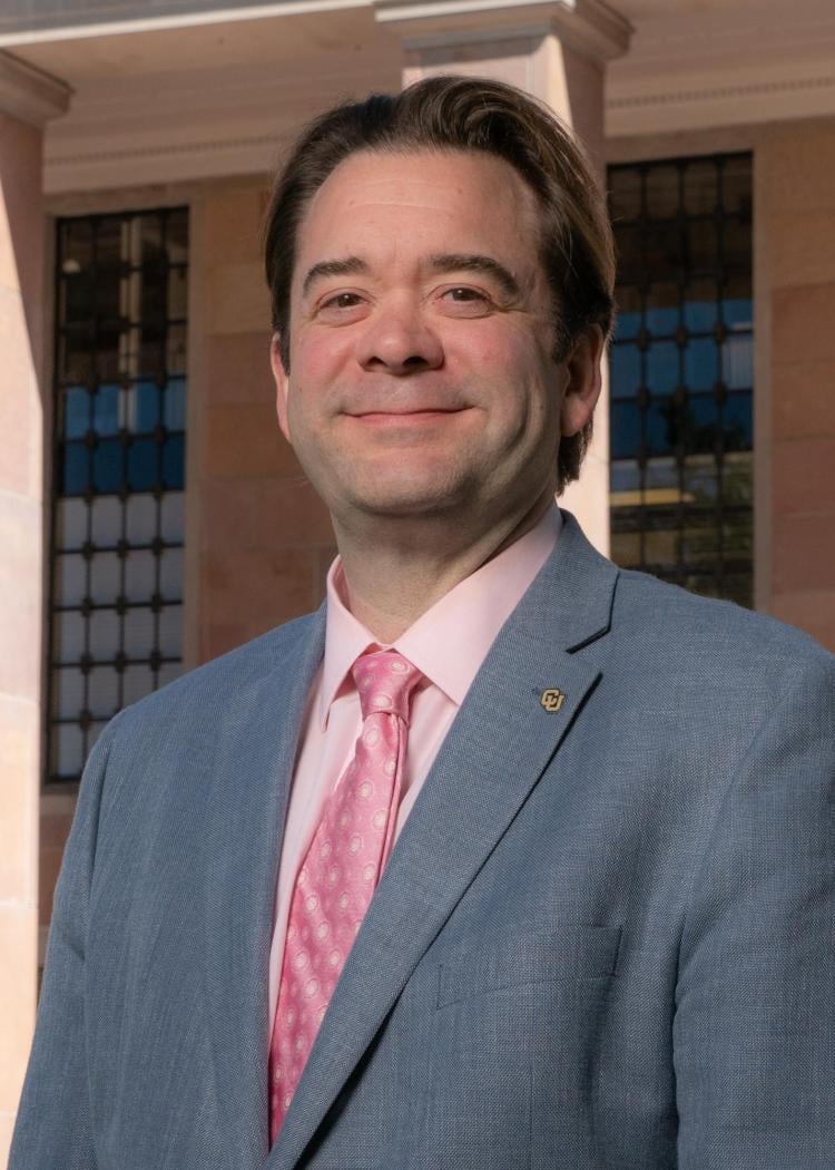Robert McDonald, a white man with dark hair wearing a suit and tie.