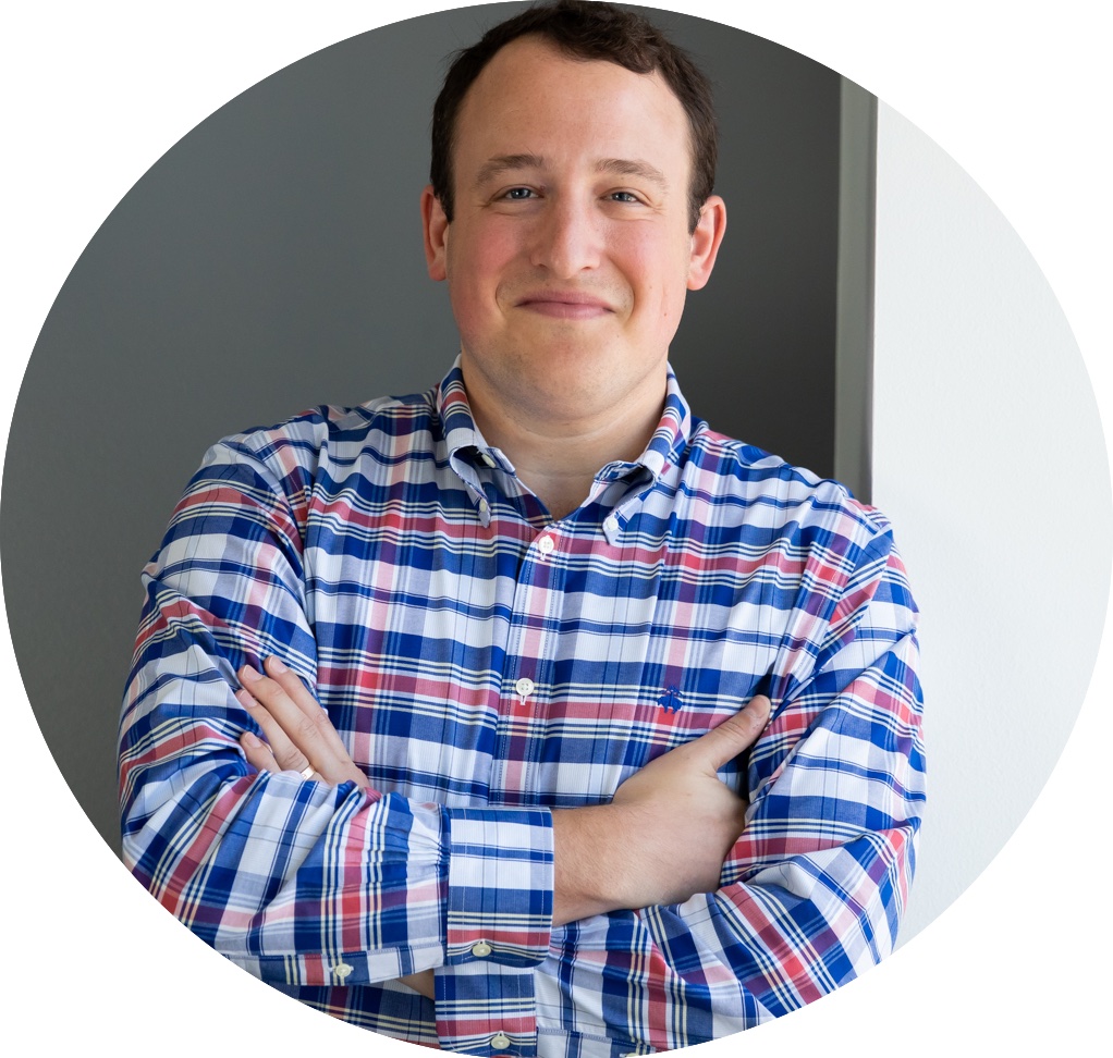 Mark Rudnick, a white man with dark hair wearing a blue and red plaid shirt.