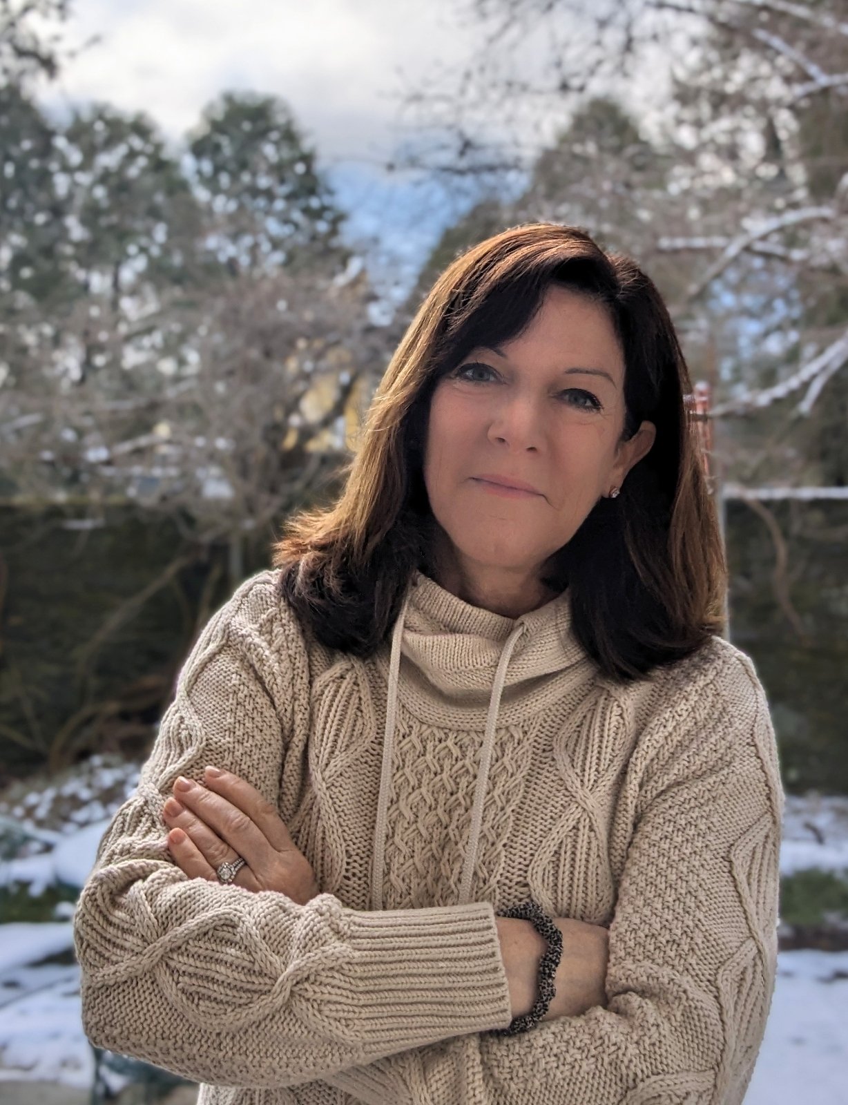 Cathy Breen, a light-skinned woman with shoulder-length brown hair.