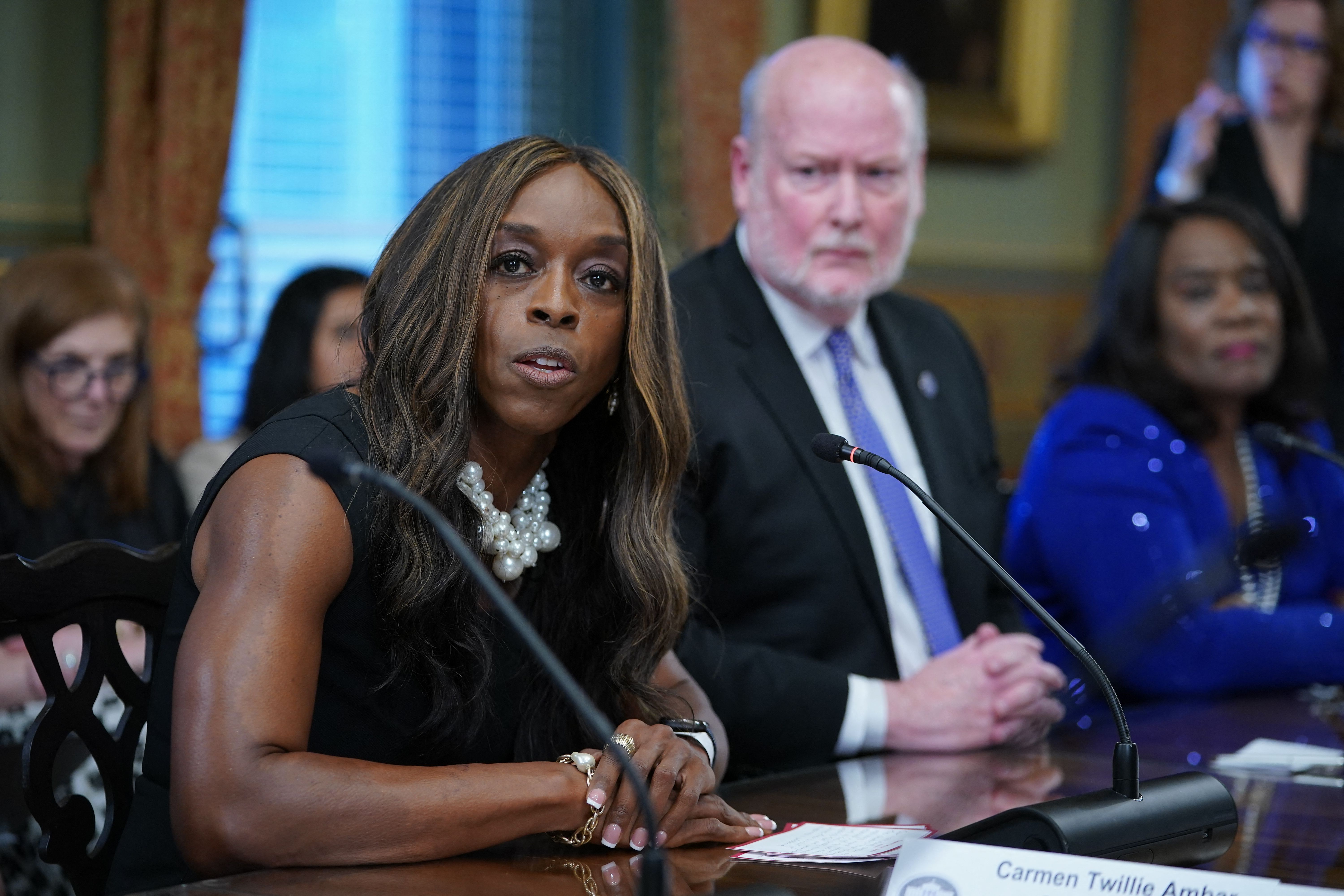 Oberlin president Carmen Twillie Ambar, a Black woman wearing a sleeveless dress.