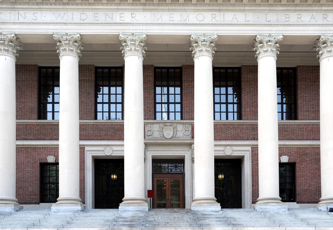 The Harvard University Library, notable for its white marble columns and brick facade.