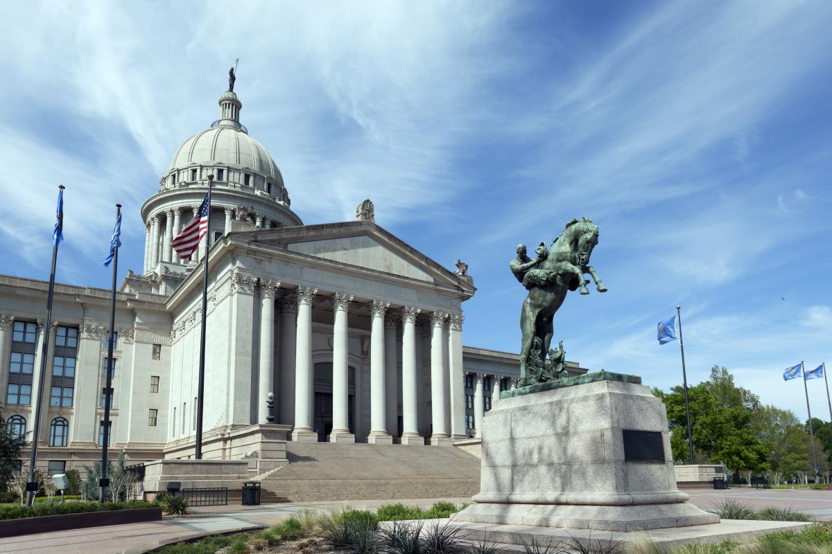 The Oklahoma state capitol building, with white columns and a dome.