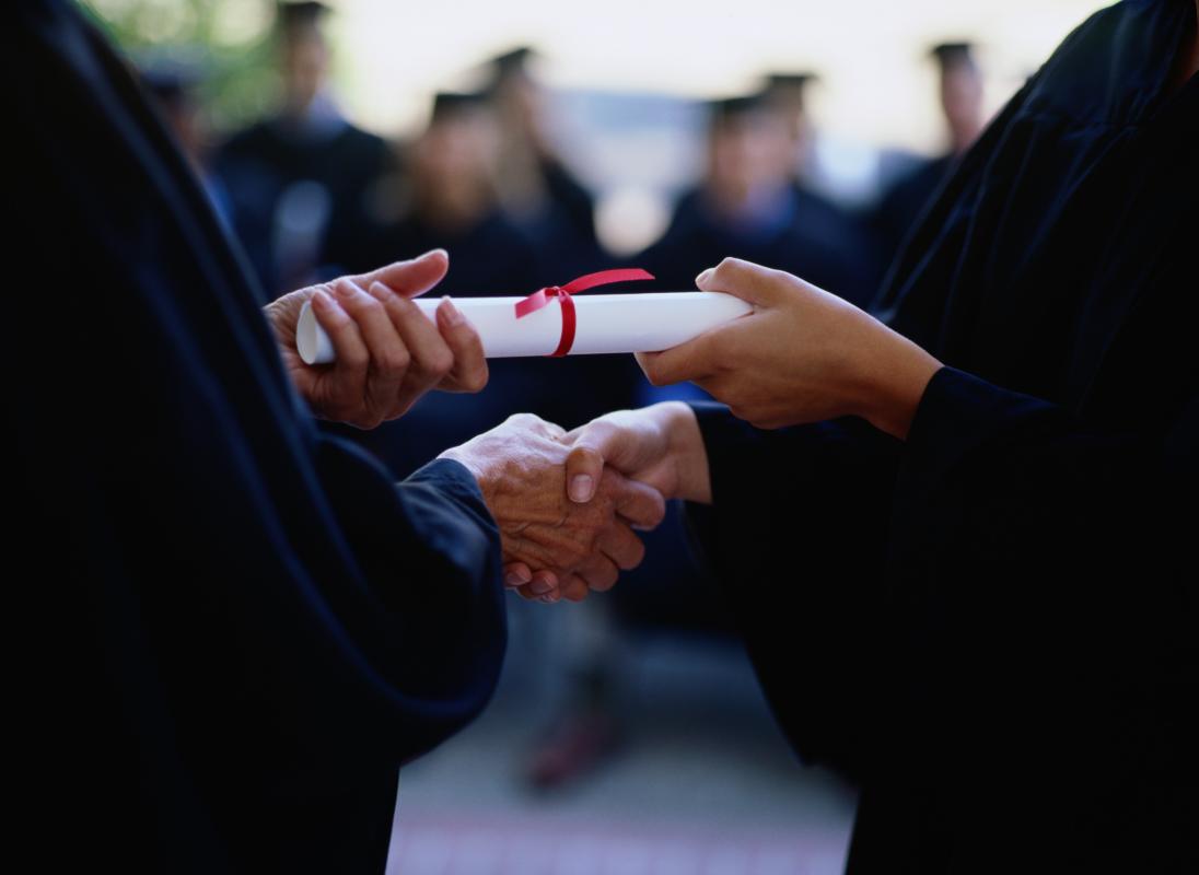 Diploma handed from one person to another