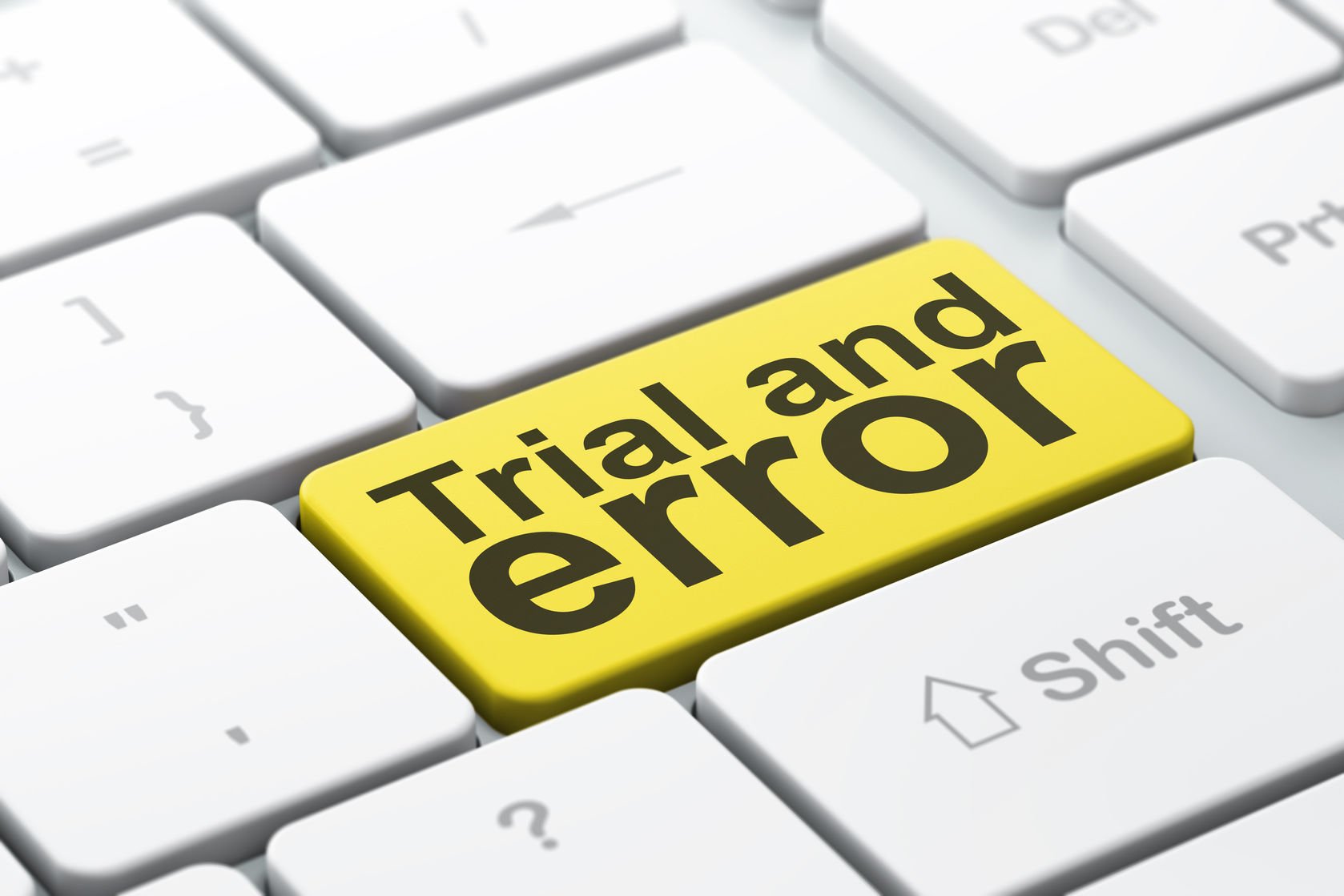 Photo illustration showing keyboard with large yellow button labeled "trial and error."