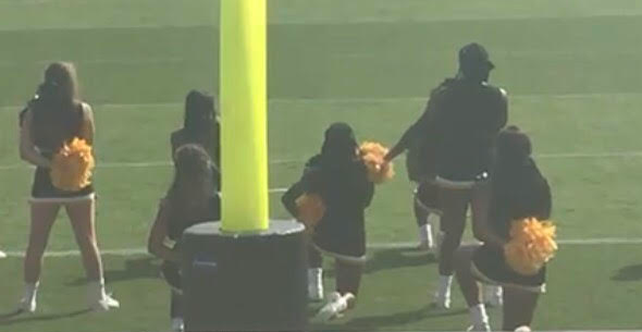 Kennesaw State cheerleaders kneeling before a game Saturday.