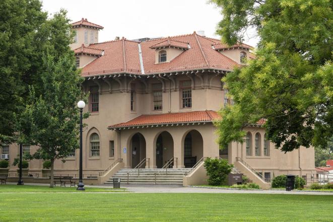 Delany Hall at Queens College surrounded by trees. 