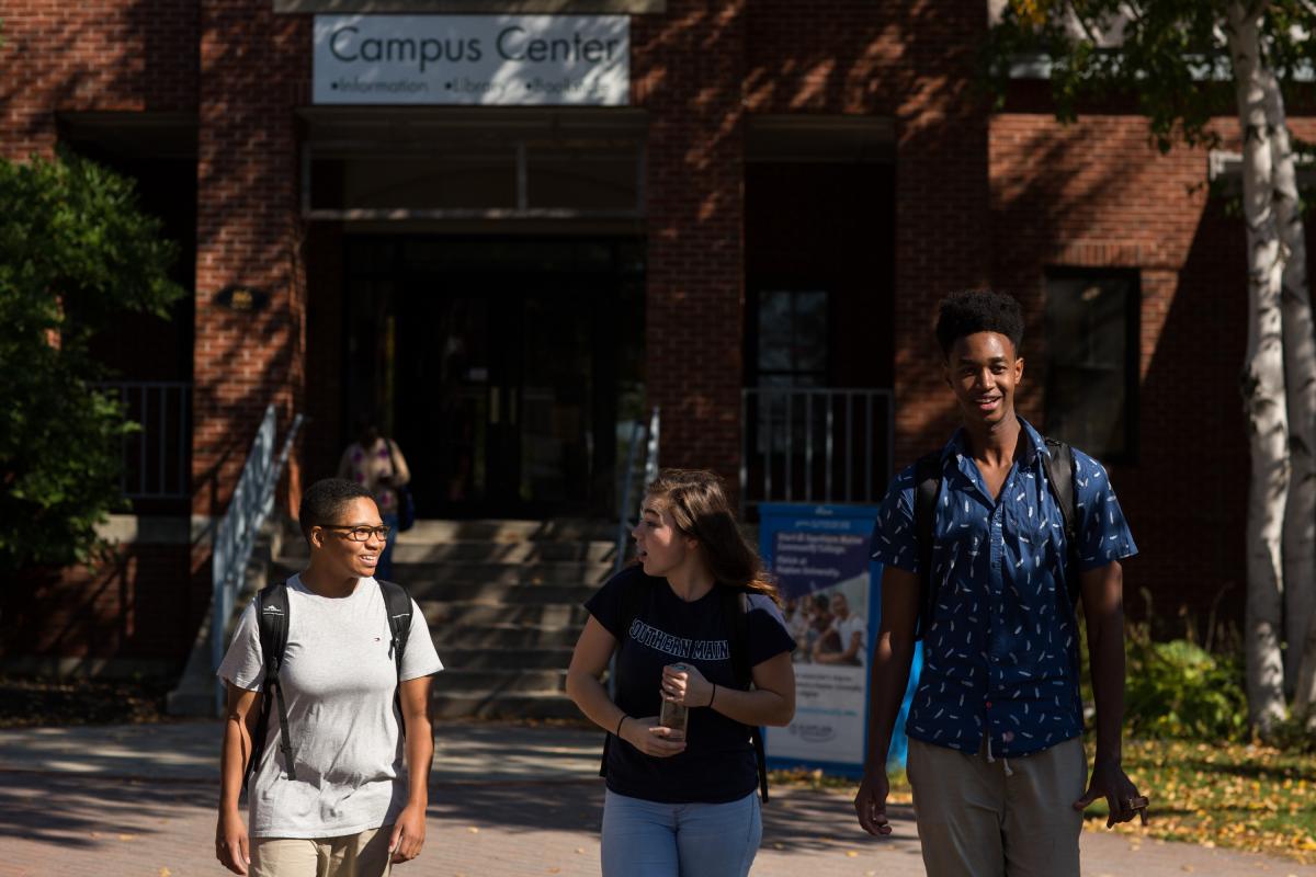 Three students walk on the Southern Maine Community College campus.