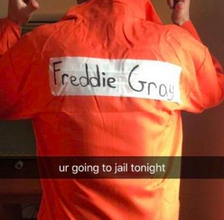 Image of a person facing away from the camera, in an orange jumpsuit with the name "Freddie Gray" written on the back. Caption on the photo says, "[You're] going to jail tonight."
