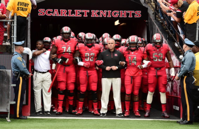 Rutgers U suspends football coach for contacting professor ...