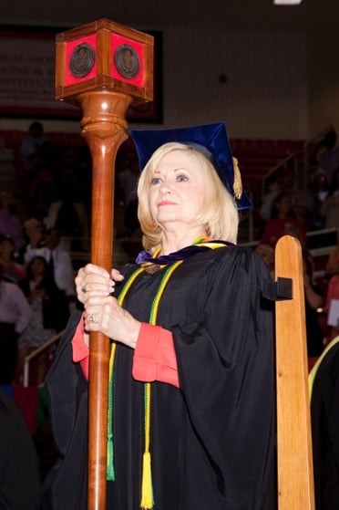 Official carrying Lamar University's mace